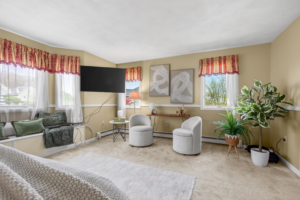43 Hampshire Road Peabody, MA 01960 - Photo 27 of 42 a living room with furniture a window and a potted plant