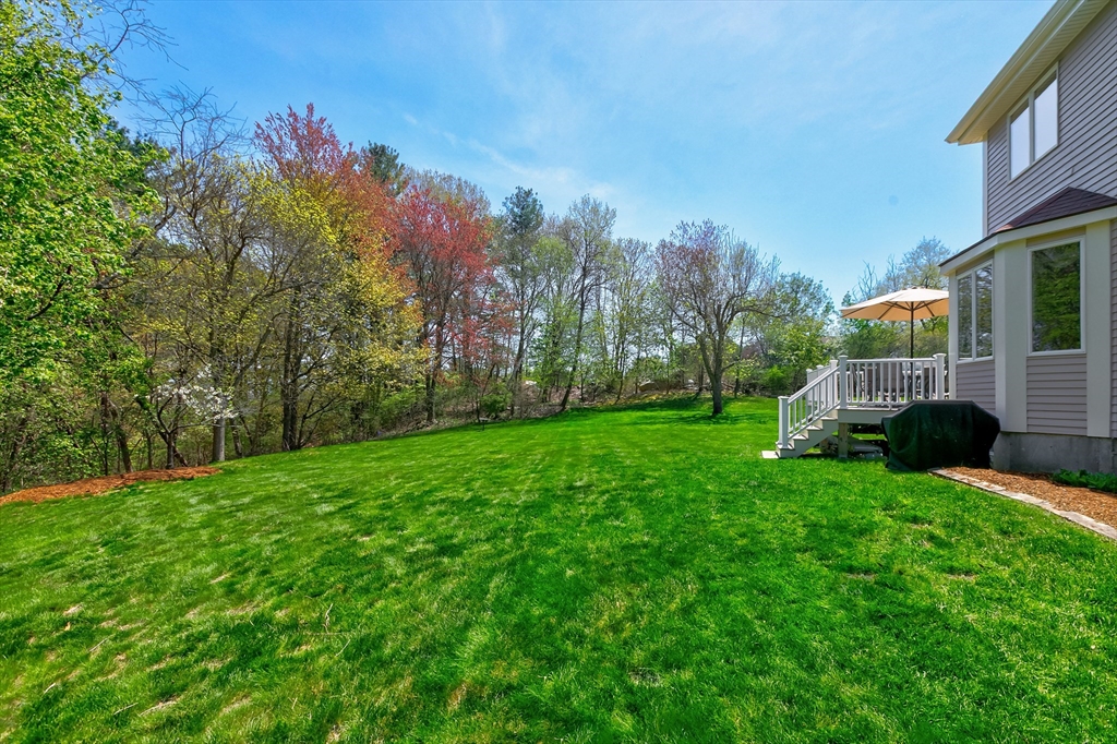 43 Hampshire Road Peabody, MA 01960 - Photo 5 of 42 a view of backyard with house and trees in the background