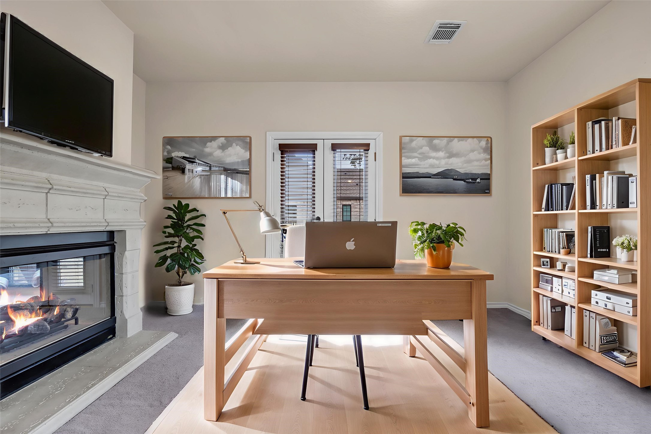 a view of a livingroom with furniture and a fireplace