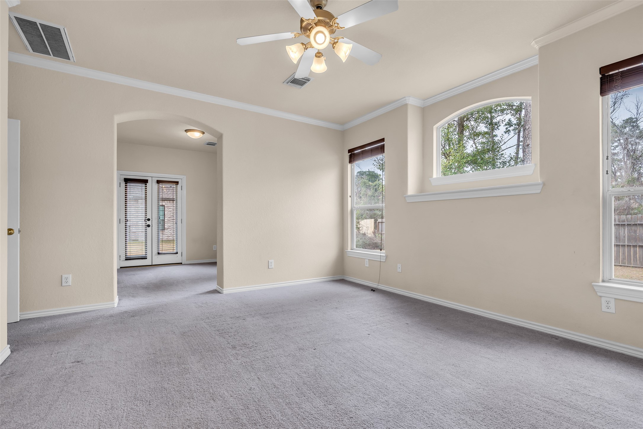 629 Spring Forest Drive Conroe, TX 77302 - Photo 12 of 38 wooden floor in an empty room with a window