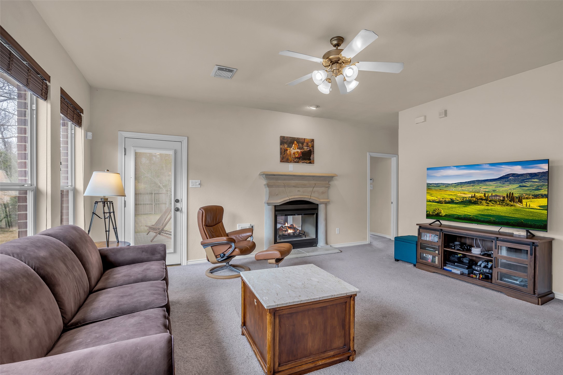 629 Spring Forest Drive Conroe, TX 77302 - Photo 13 of 38 a living room with furniture and a flat screen tv