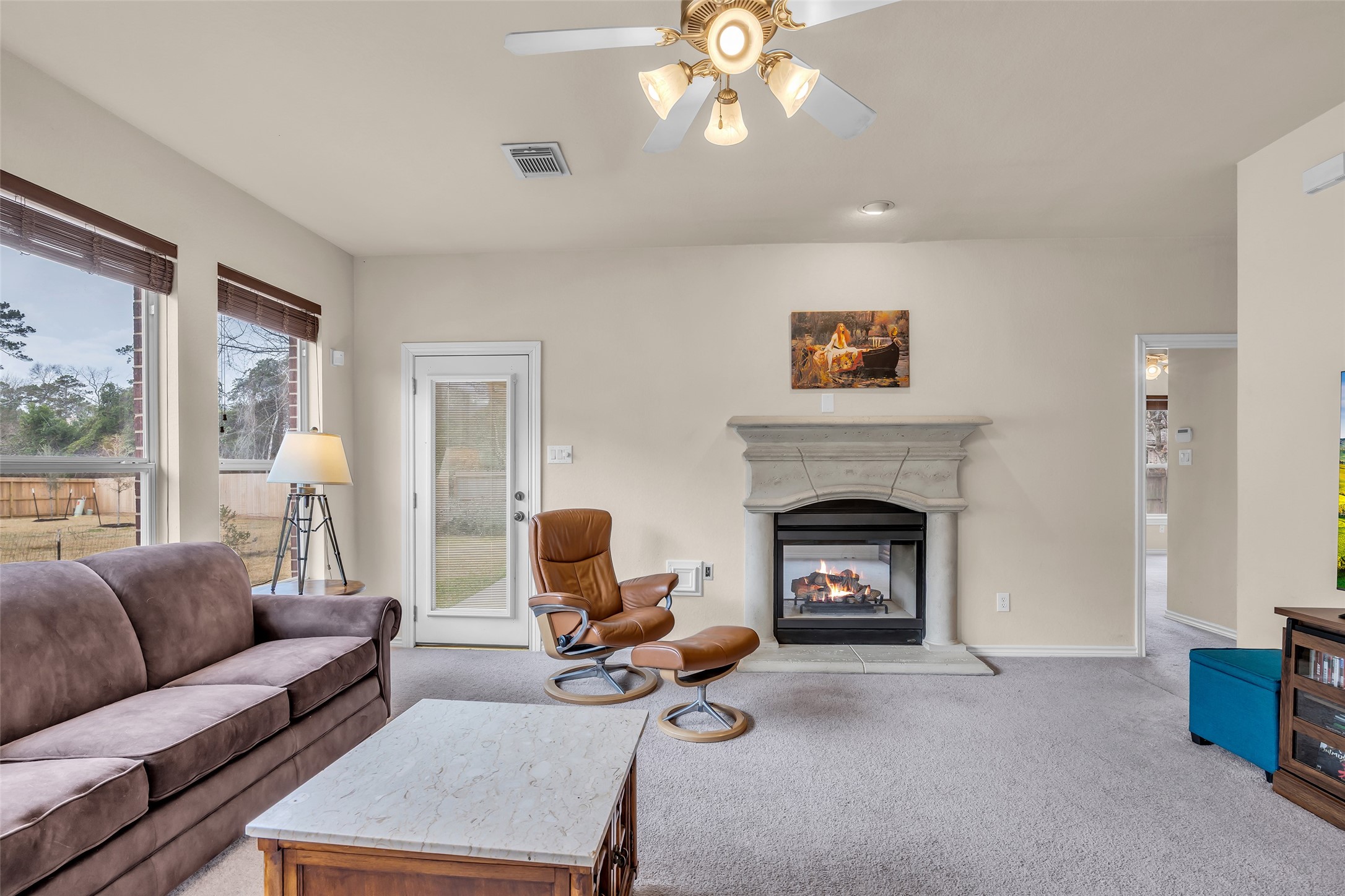 629 Spring Forest Drive Conroe, TX 77302 - Photo 14 of 38 a living room with furniture and a fireplace