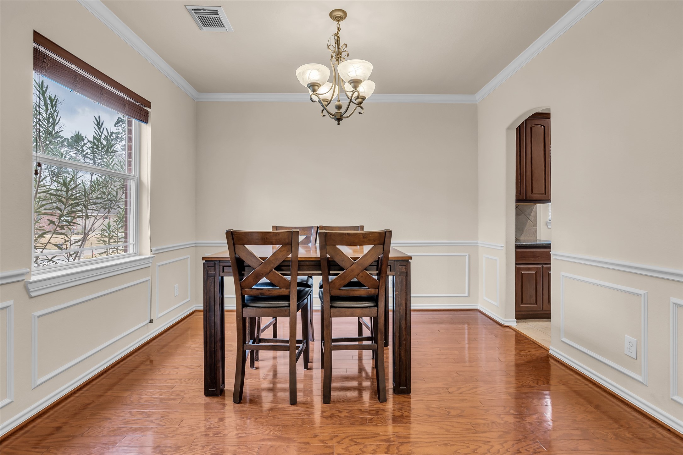 629 Spring Forest Drive Conroe, TX 77302 - Photo 17 of 38 a view of a dining room with furniture window and wooden floor