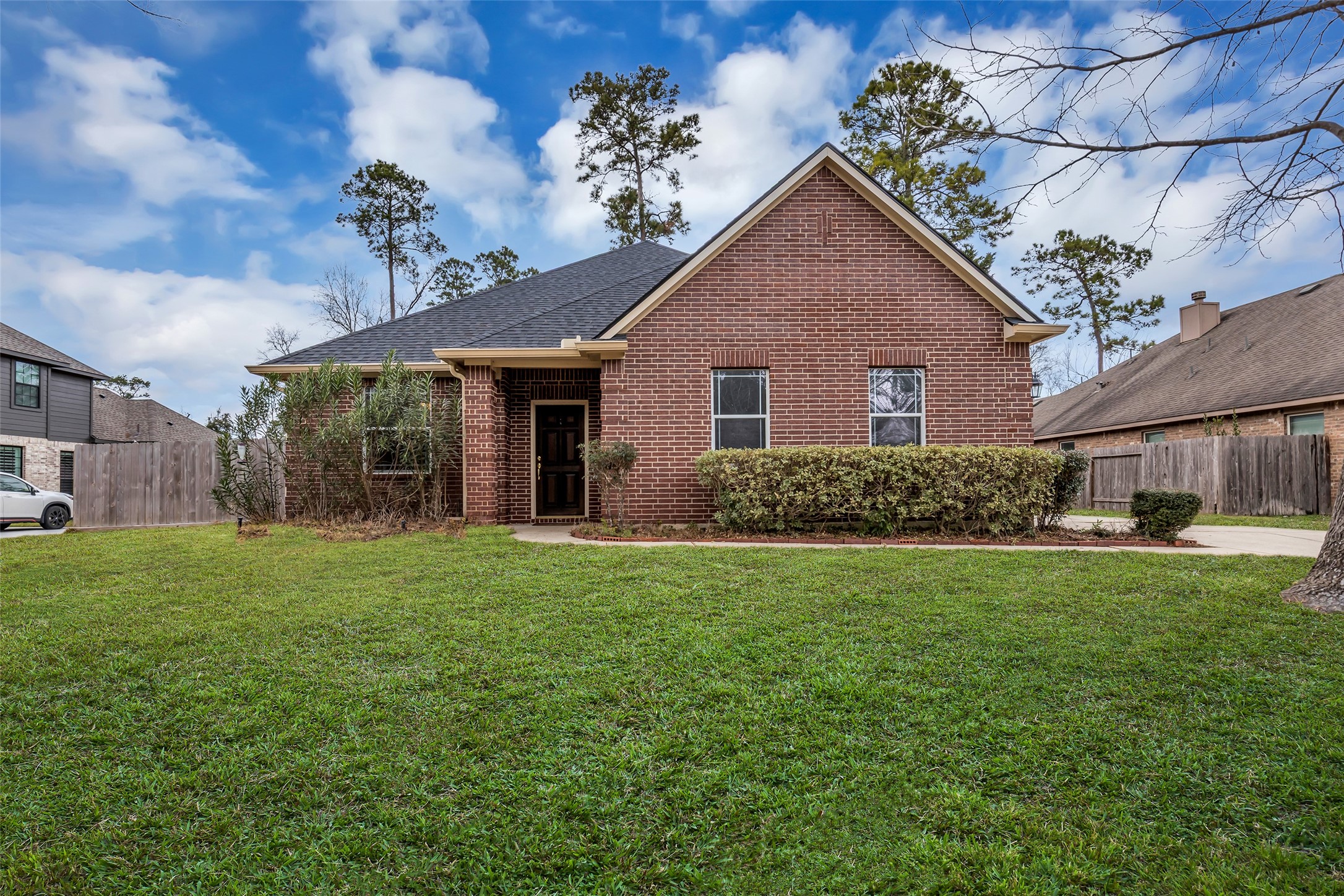 629 Spring Forest Drive Conroe, TX 77302 - Photo 2 of 38 a front view of house with yard and green space