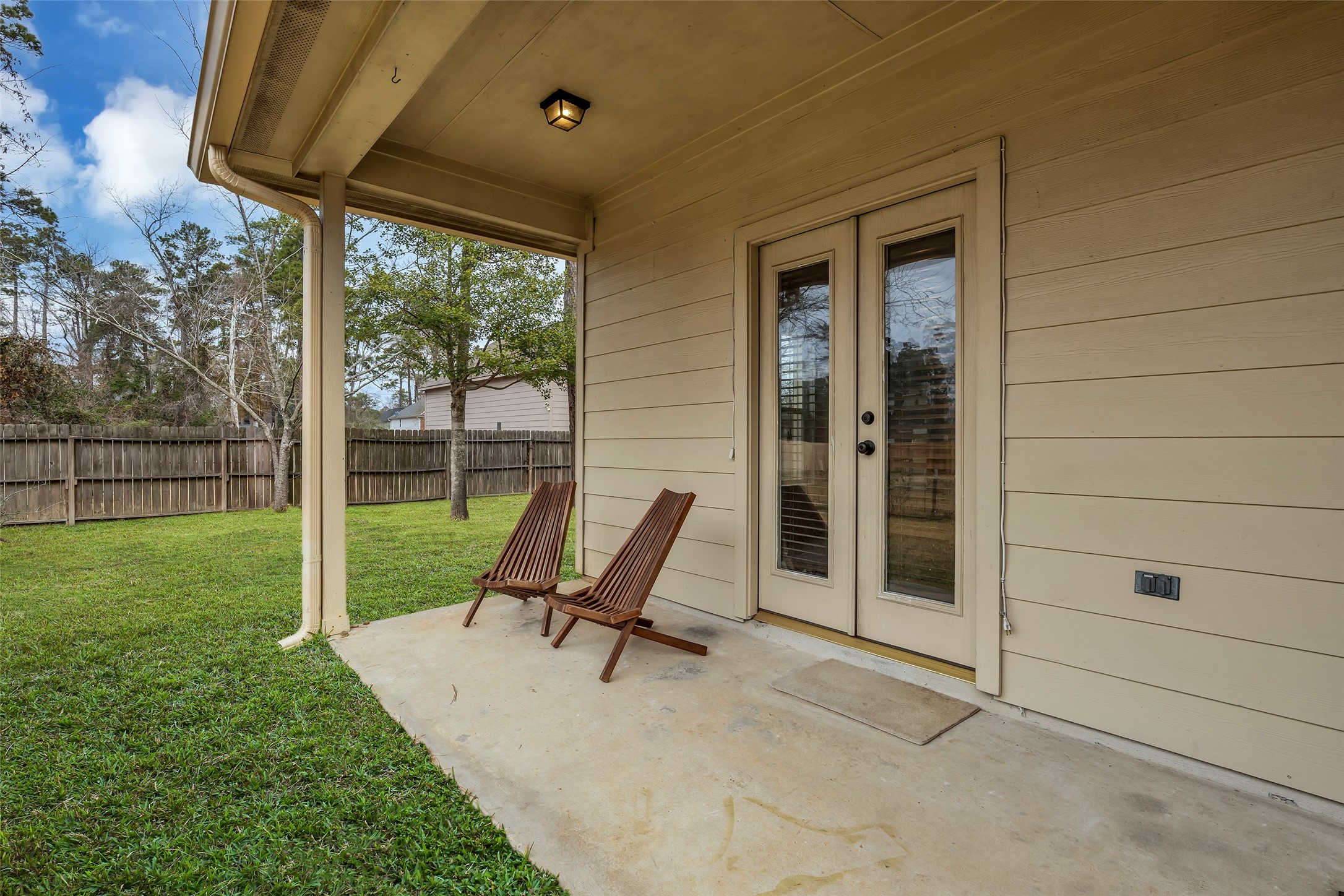629 Spring Forest Drive Conroe, TX 77302 - Photo 27 of 38 a bench sitting in front of a house
