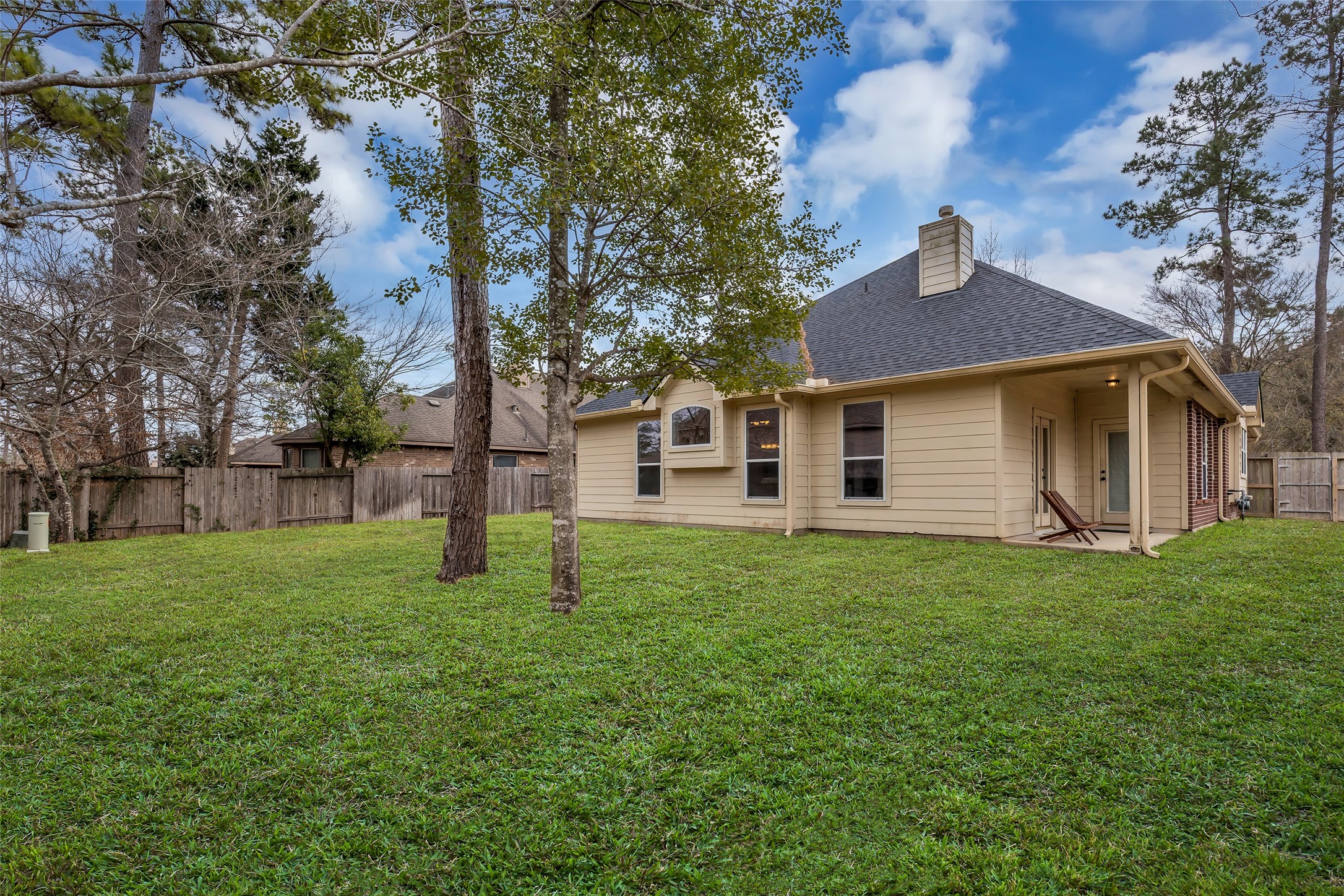 629 Spring Forest Drive Conroe, TX 77302 - Photo 29 of 38 a house that is sitting in the grass