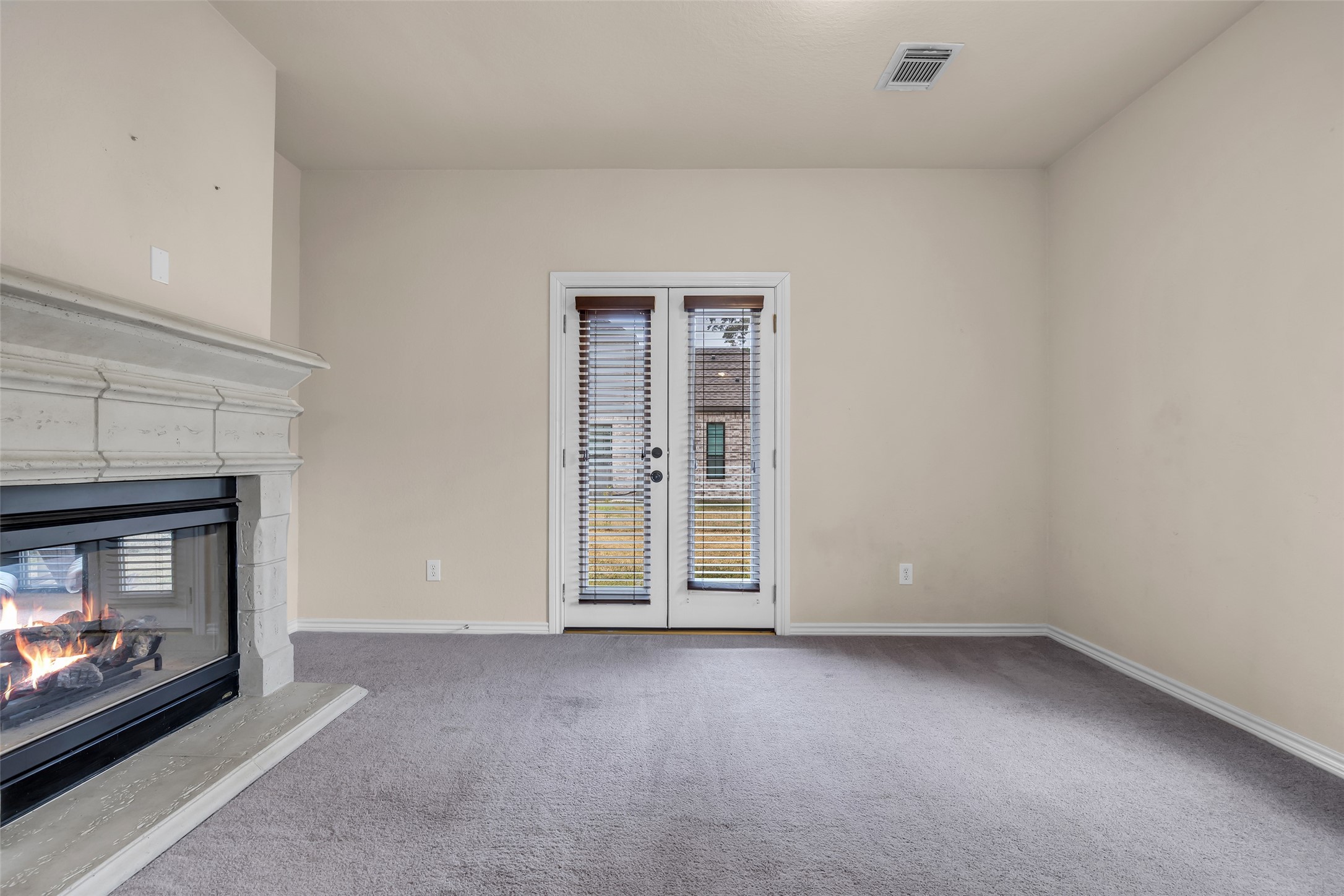 629 Spring Forest Drive Conroe, TX 77302 - Photo 6 of 38 a view of an empty room with a fireplace