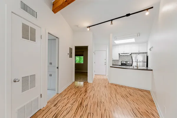 a view of a kitchen from the hallway