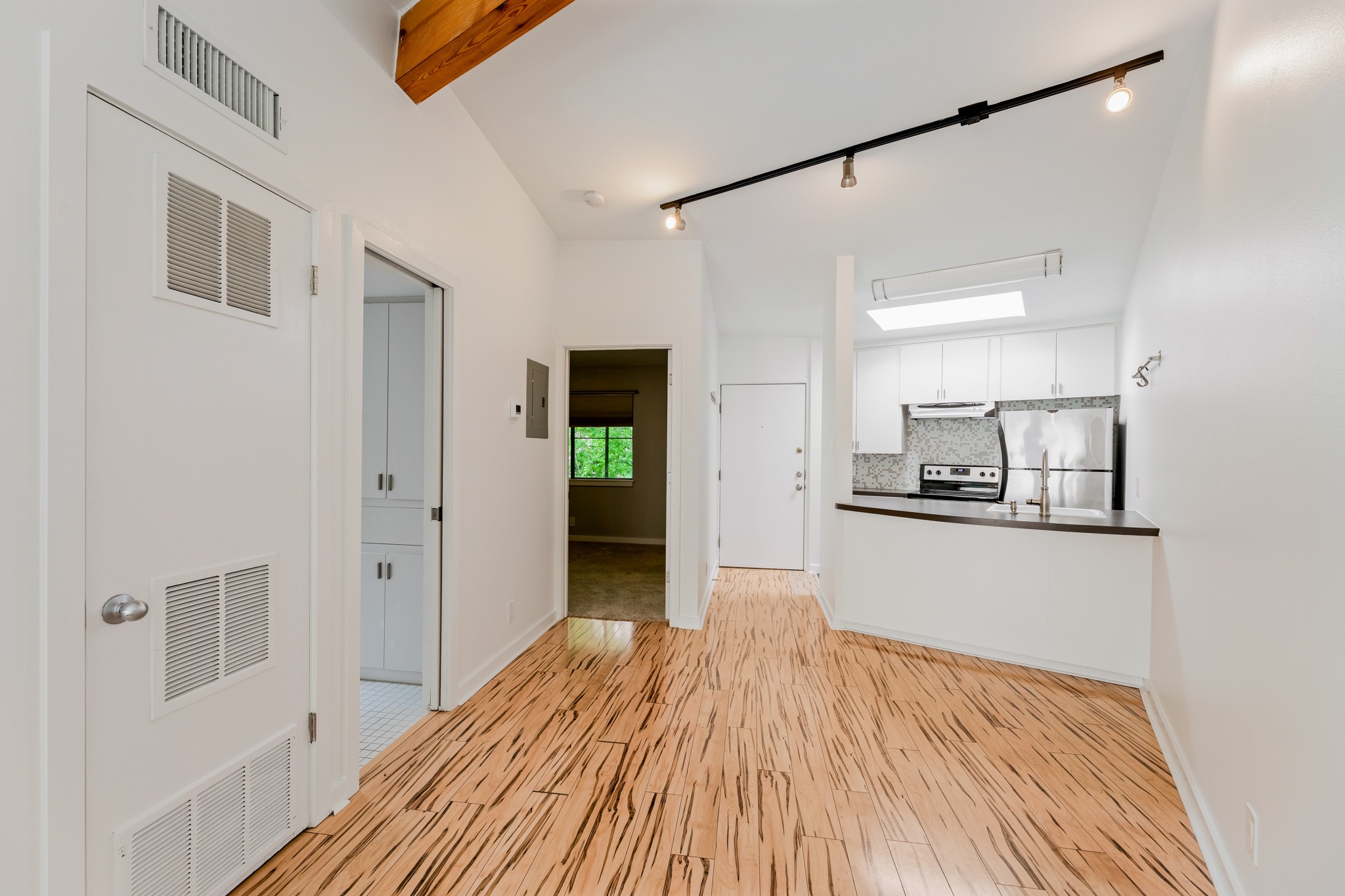 2308 Enfield Road, Unit 204 Austin, TX 78703 - Photo 11 of 30 a view of a kitchen from the hallway
