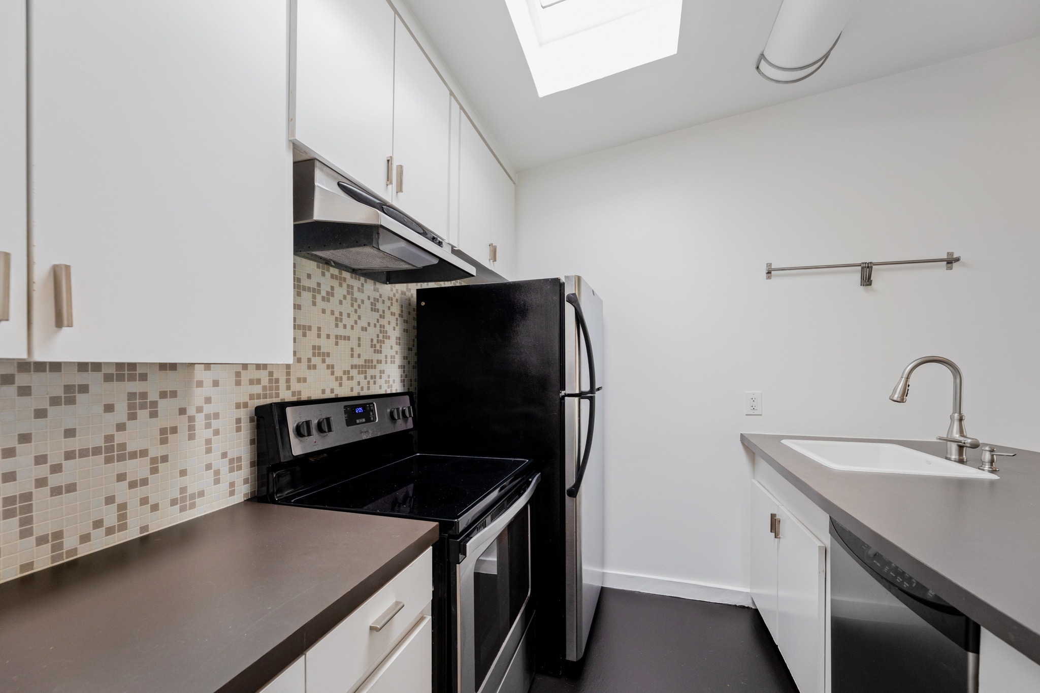 2308 Enfield Road, Unit 204 Austin, TX 78703 - Photo 15 of 30 a kitchen with stainless steel appliances granite countertop a sink and a stove