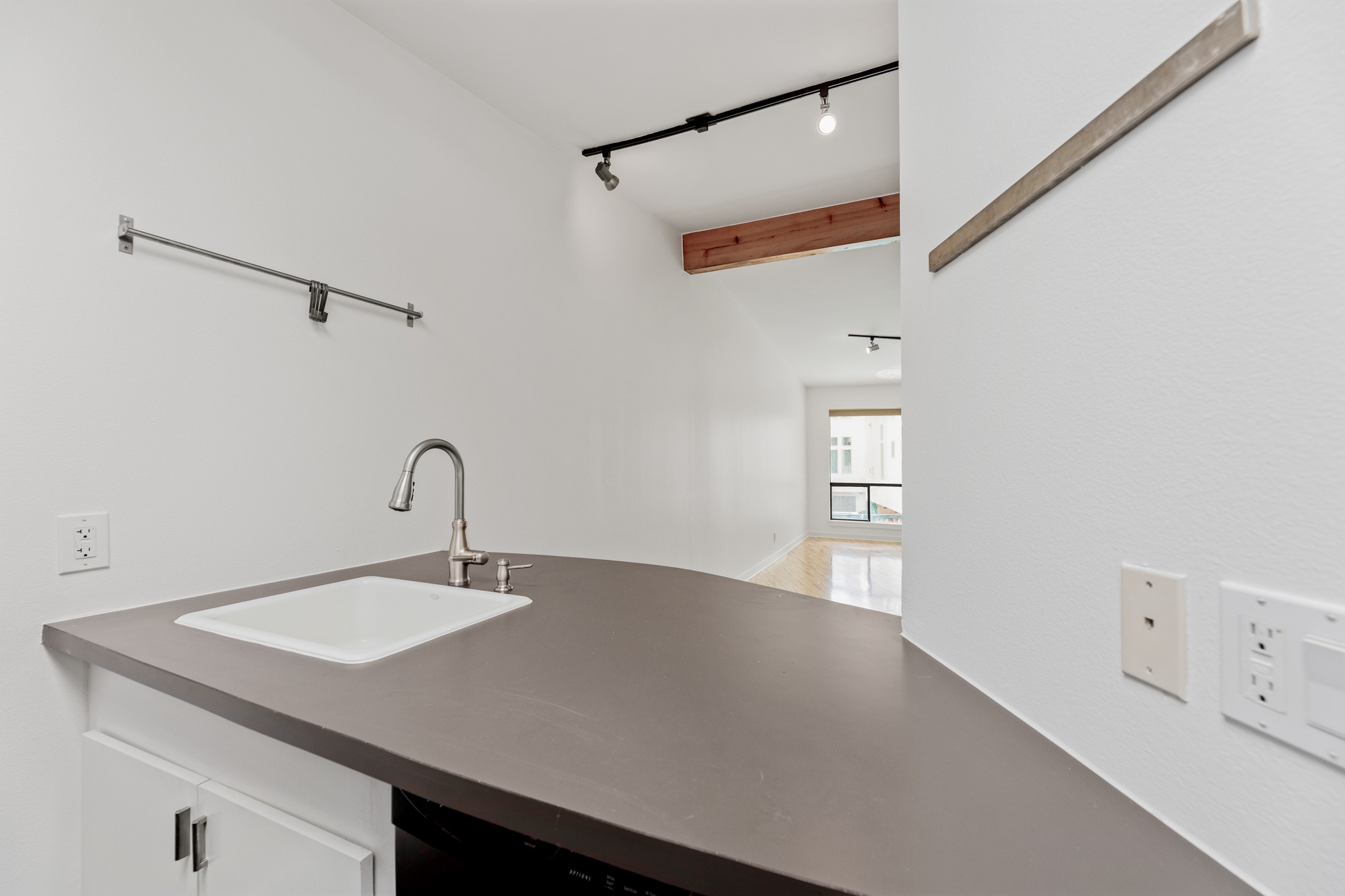 2308 Enfield Road, Unit 204 Austin, TX 78703 - Photo 17 of 30 a close view of a sink a faucet and a table in a room