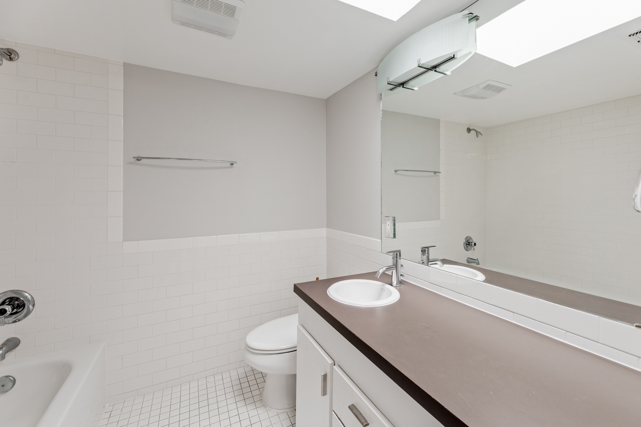 2308 Enfield Road, Unit 204 Austin, TX 78703 - Photo 25 of 30 a bathroom with a sink toilet and shower