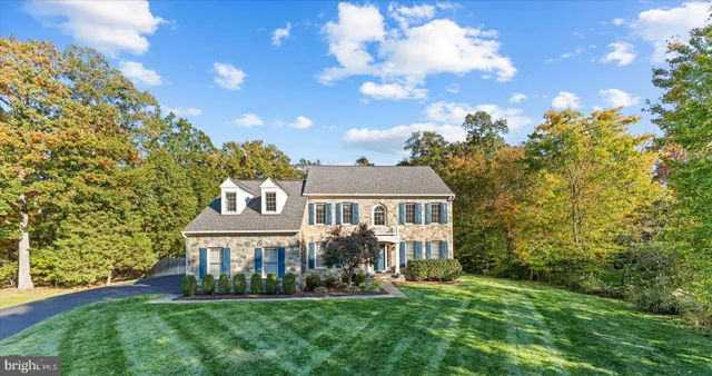 a front view of a building with a garden