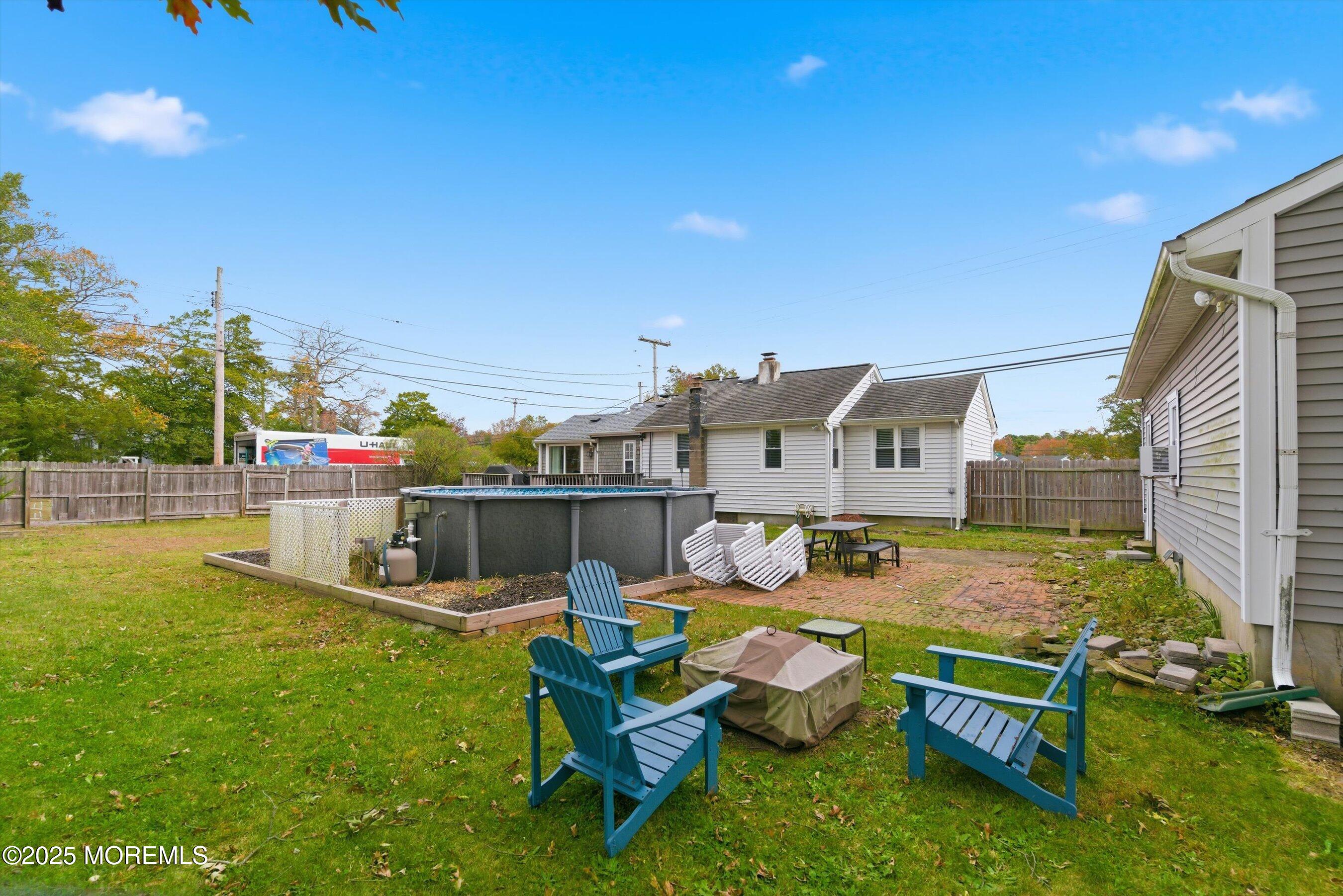 625 Drum Point Road Brick, NJ 08723 - Photo 16 of 22 a swimming pool with outdoor seating and yard