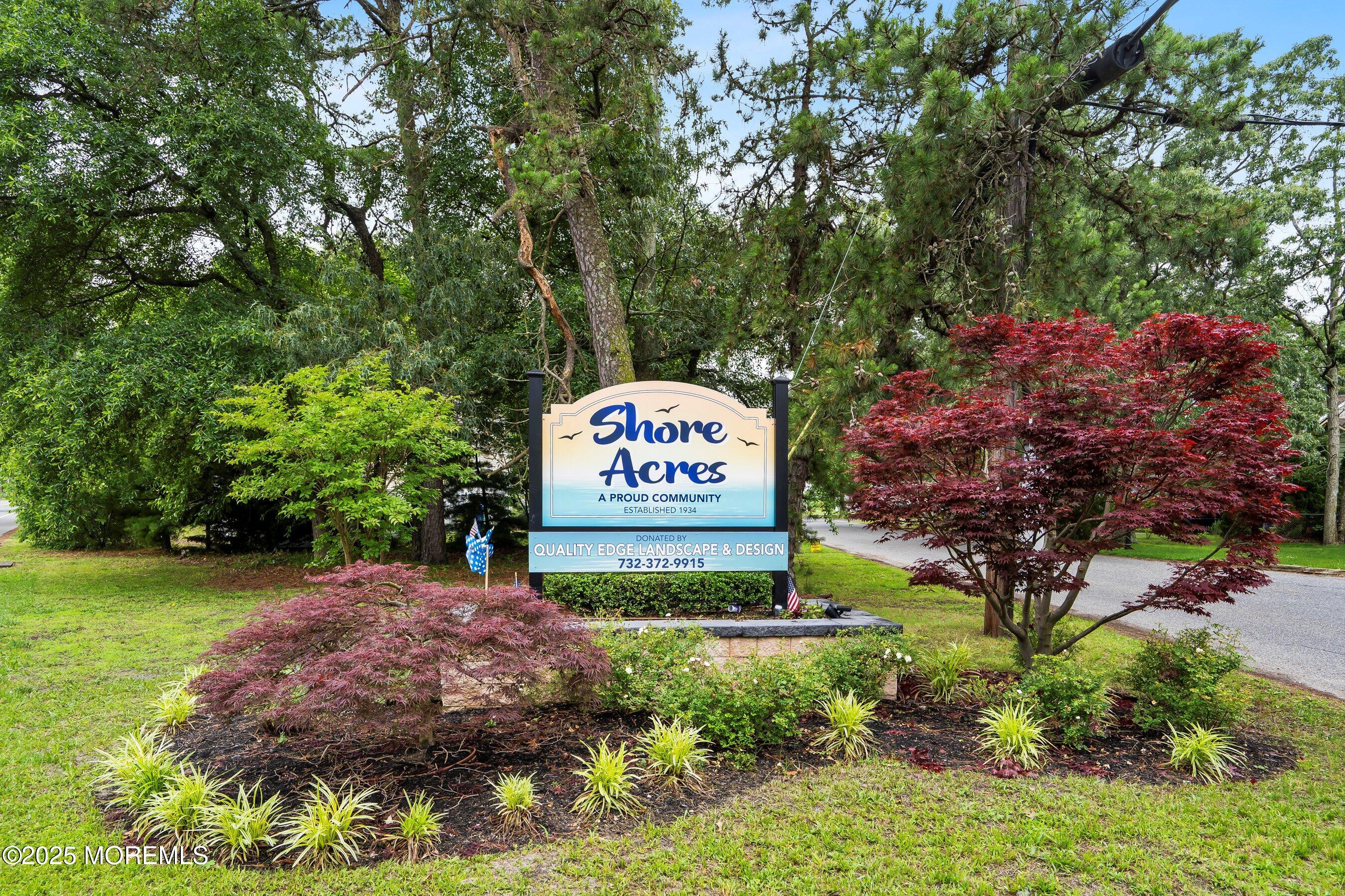 625 Drum Point Road Brick, NJ 08723 - Photo 18 of 22 a view of a sign board with a garden
