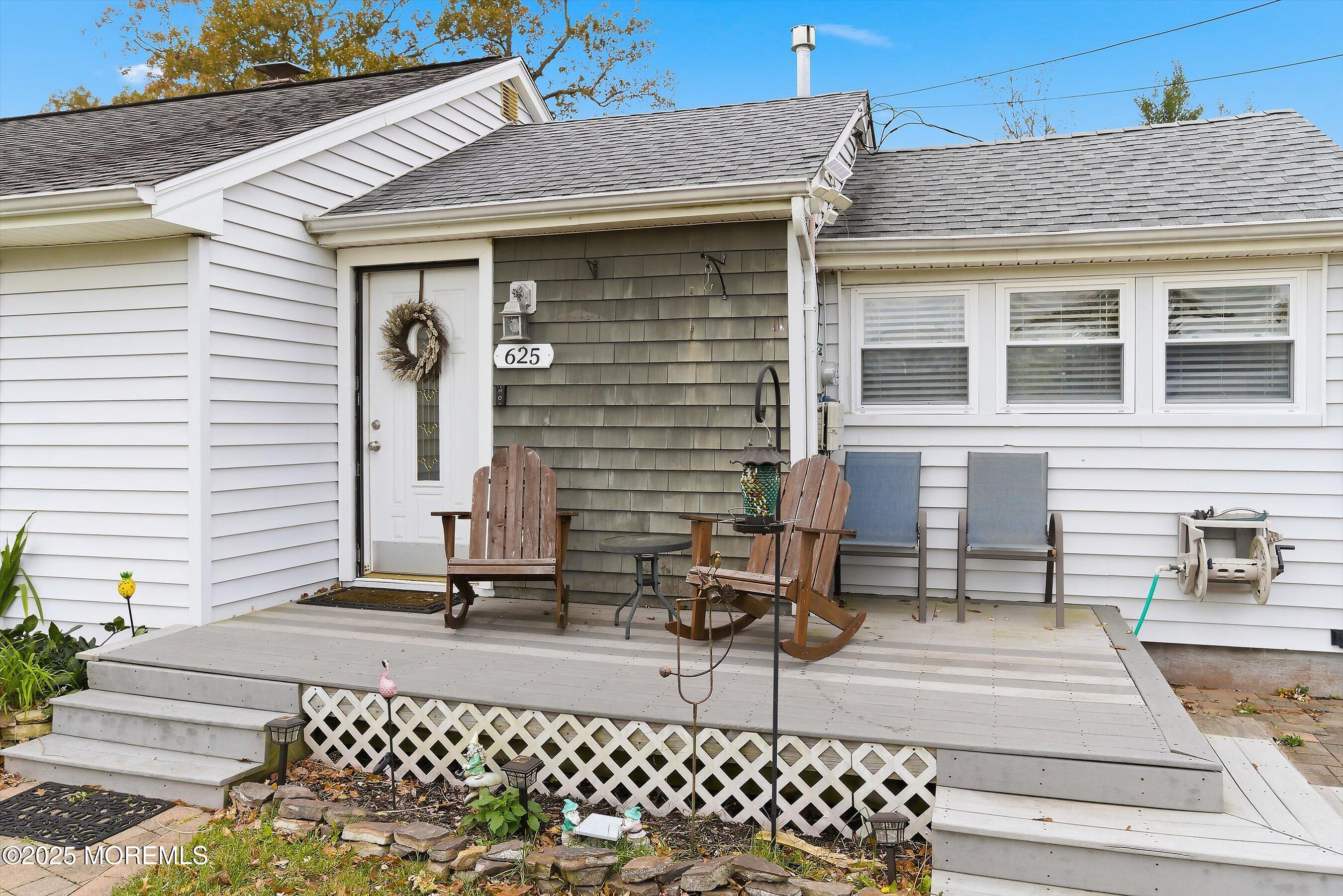 625 Drum Point Road Brick, NJ 08723 - Photo 2 of 22 a view of a terrace with a bench