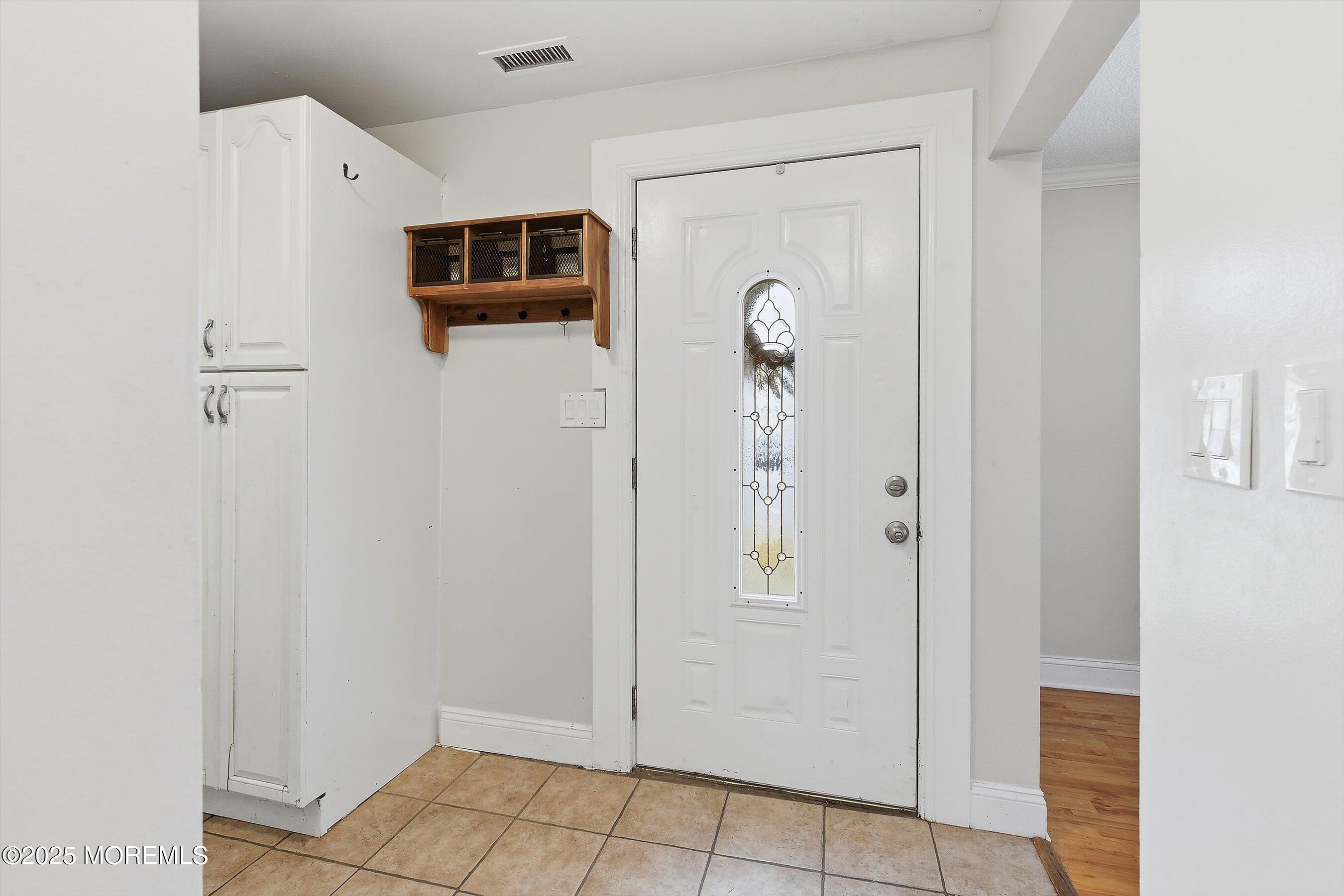 625 Drum Point Road Brick, NJ 08723 - Photo 3 of 22 a view of a livingroom from the hallway