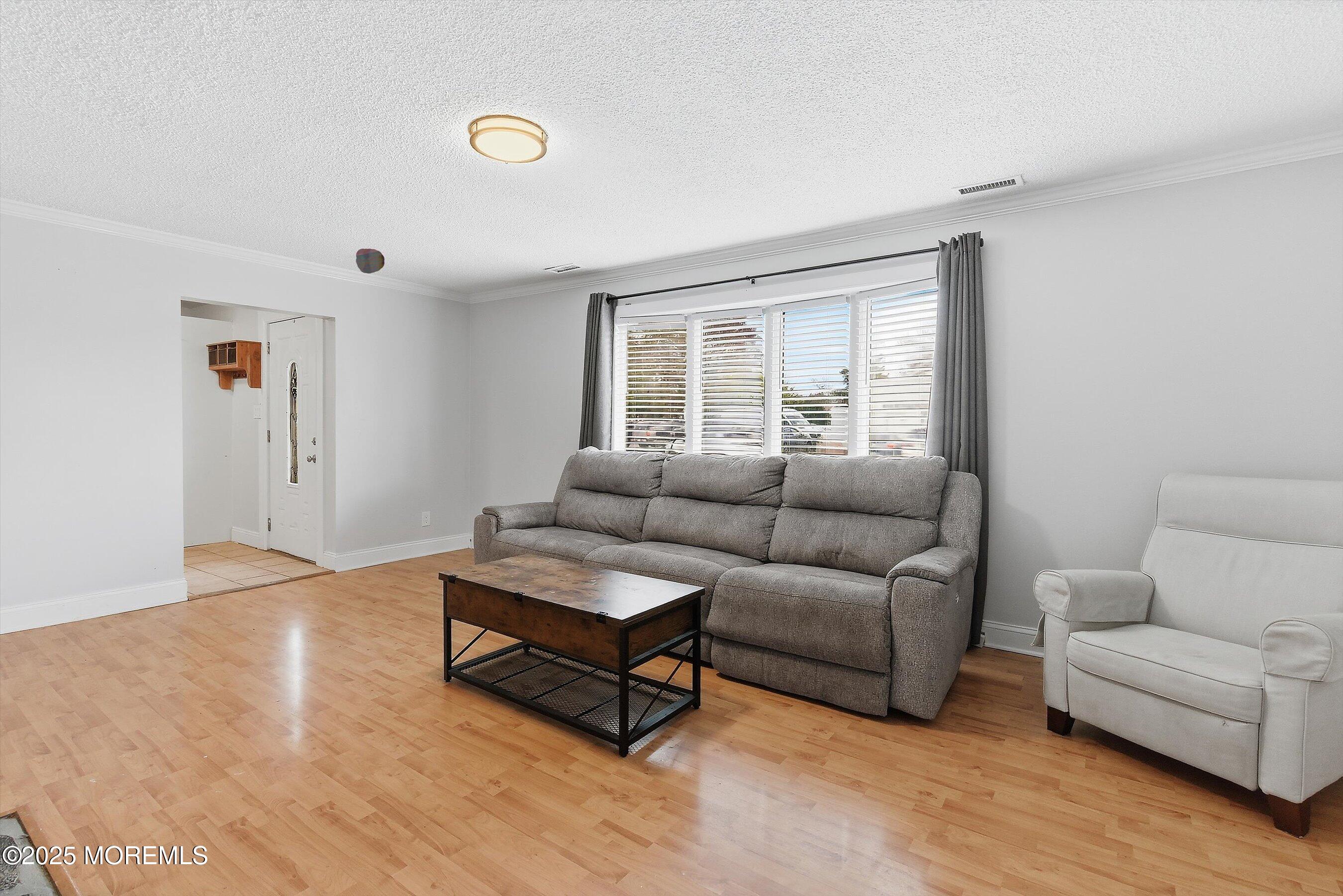 625 Drum Point Road Brick, NJ 08723 - Photo 5 of 22 a living room with furniture and wooden floor
