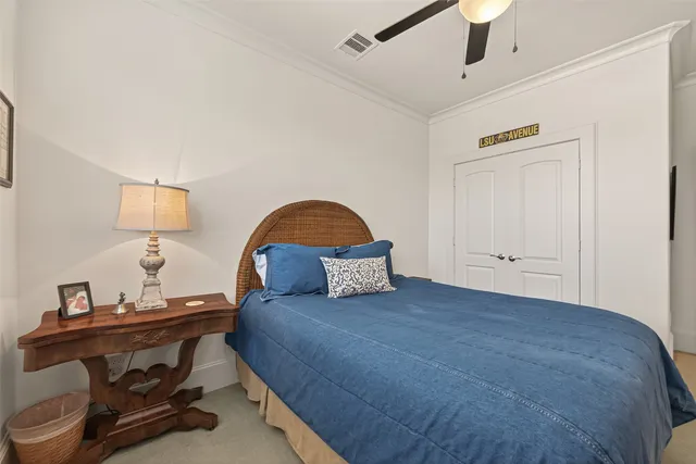 a bedroom with a bed and a dresser