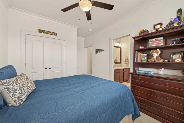 a spacious bedroom with a bed and a cabinets