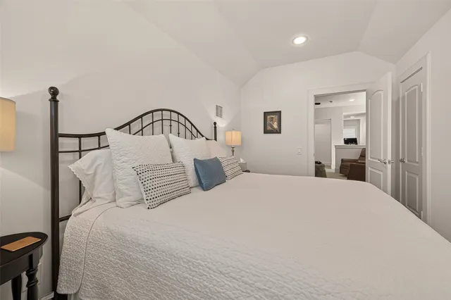 a bedroom with a bed and a dresser