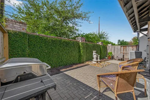 a view of a backyard with sitting area