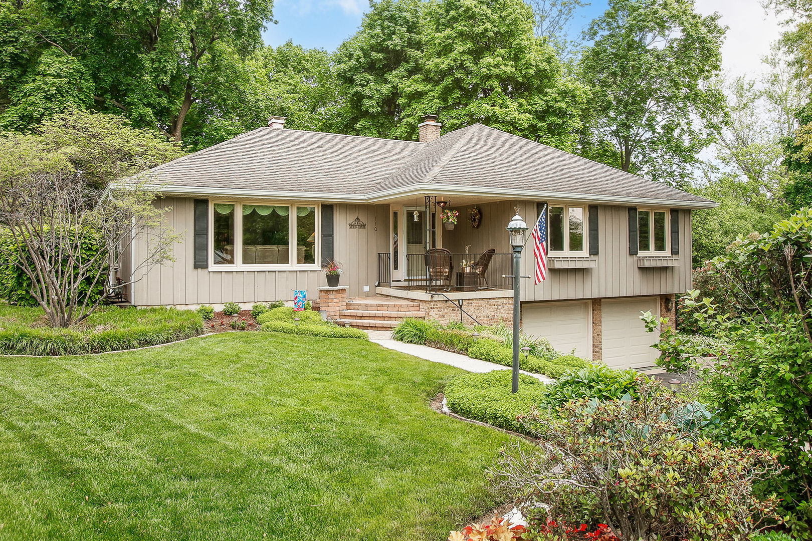 110 Stuarton Drive Wheaton, IL 60189 - Photo 1 of 30 a front view of a house with a yard