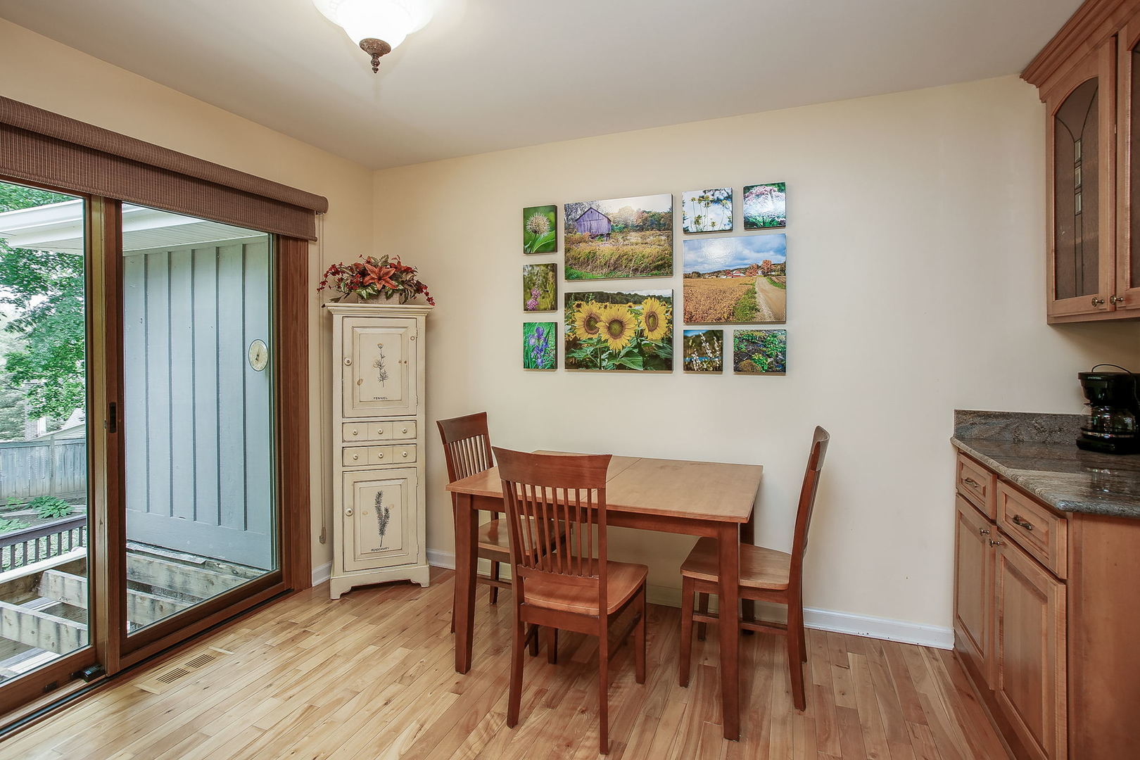 110 Stuarton Drive Wheaton, IL 60189 - Photo 20 of 30 a view of a dining room with furniture and a window