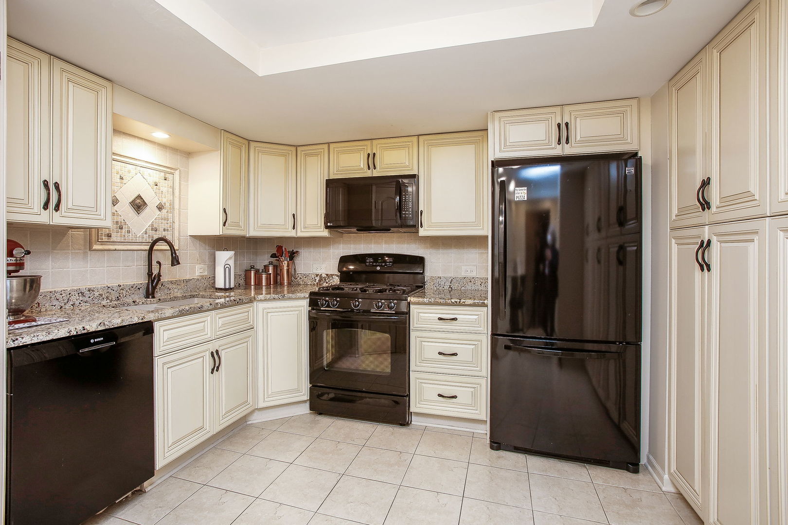 110 Stuarton Drive Wheaton, IL 60189 - Photo 26 of 30 a kitchen with a refrigerator stove and sink