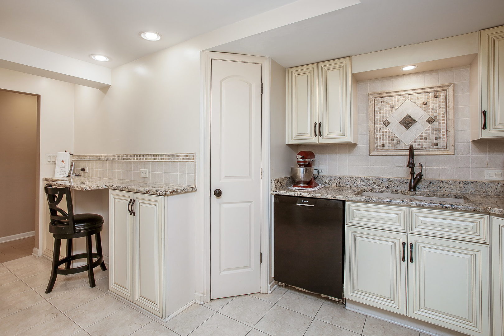 110 Stuarton Drive Wheaton, IL 60189 - Photo 27 of 30 a kitchen with a sink and cabinets