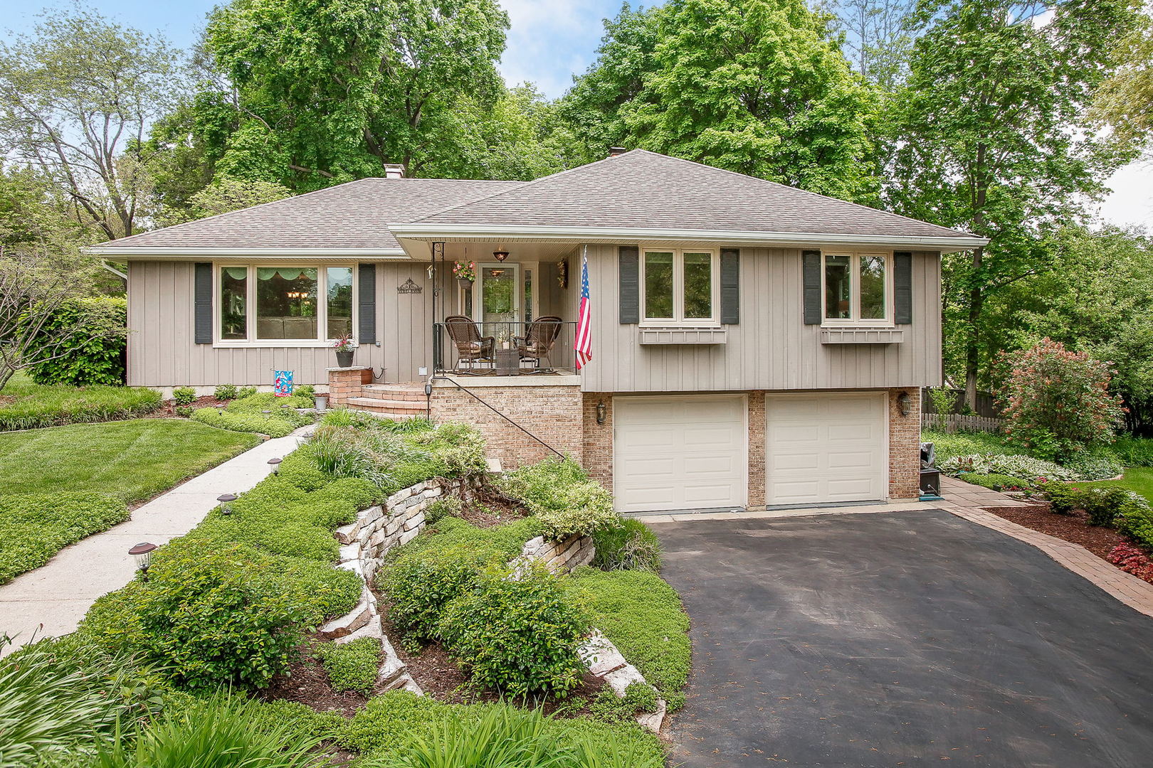 110 Stuarton Drive Wheaton, IL 60189 - Photo 30 of 30 a front view of a house with a yard and porch