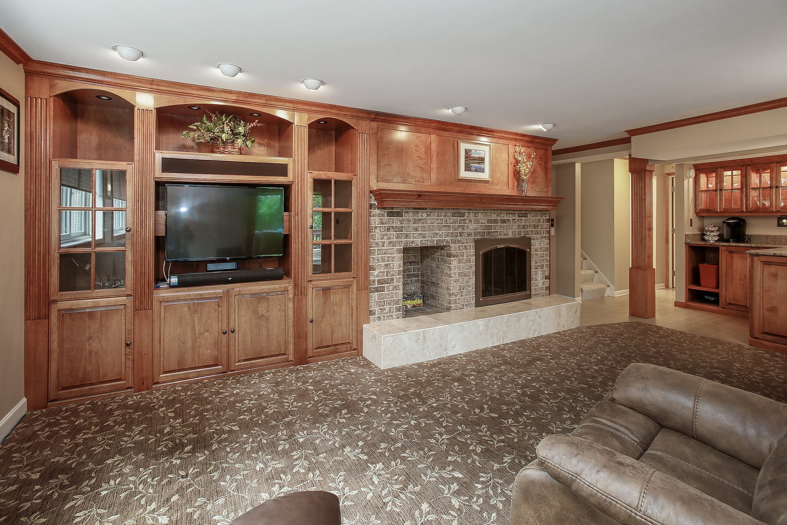 110 Stuarton Drive Wheaton, IL 60189 - Photo 5 of 30 a living room with furniture and a flat screen tv