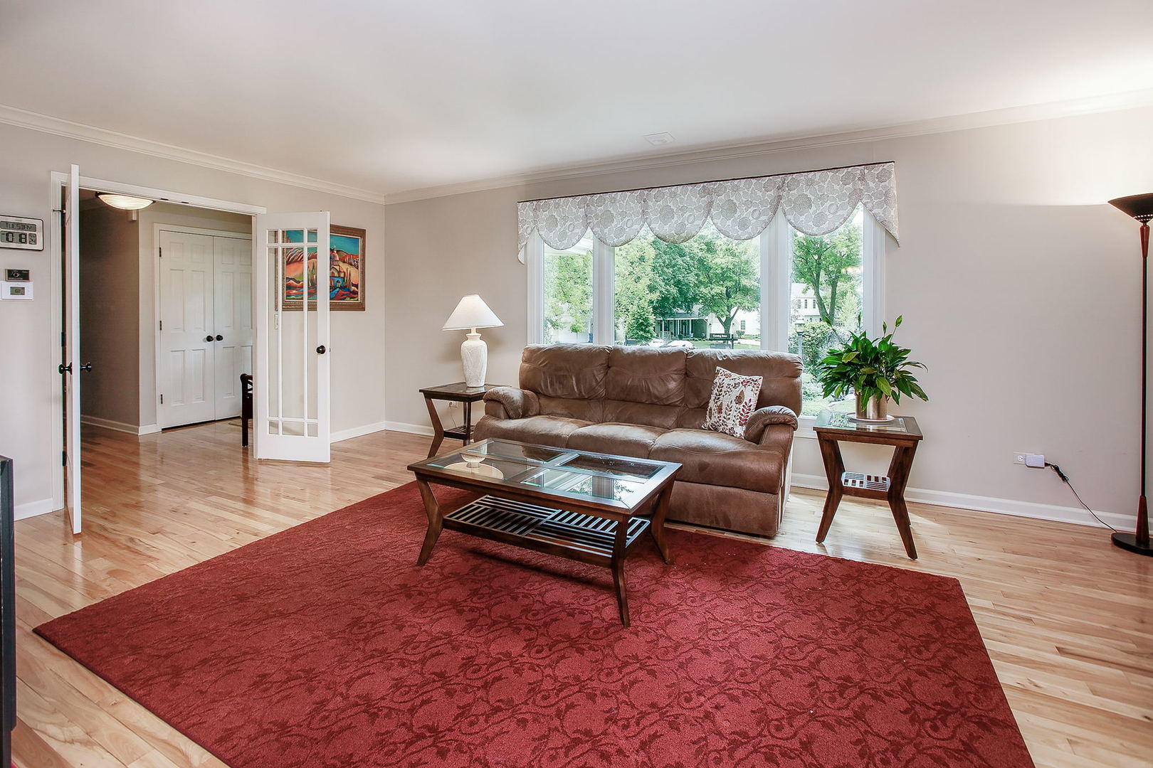 110 Stuarton Drive Wheaton, IL 60189 - Photo 10 of 30 a living room with furniture and a large window