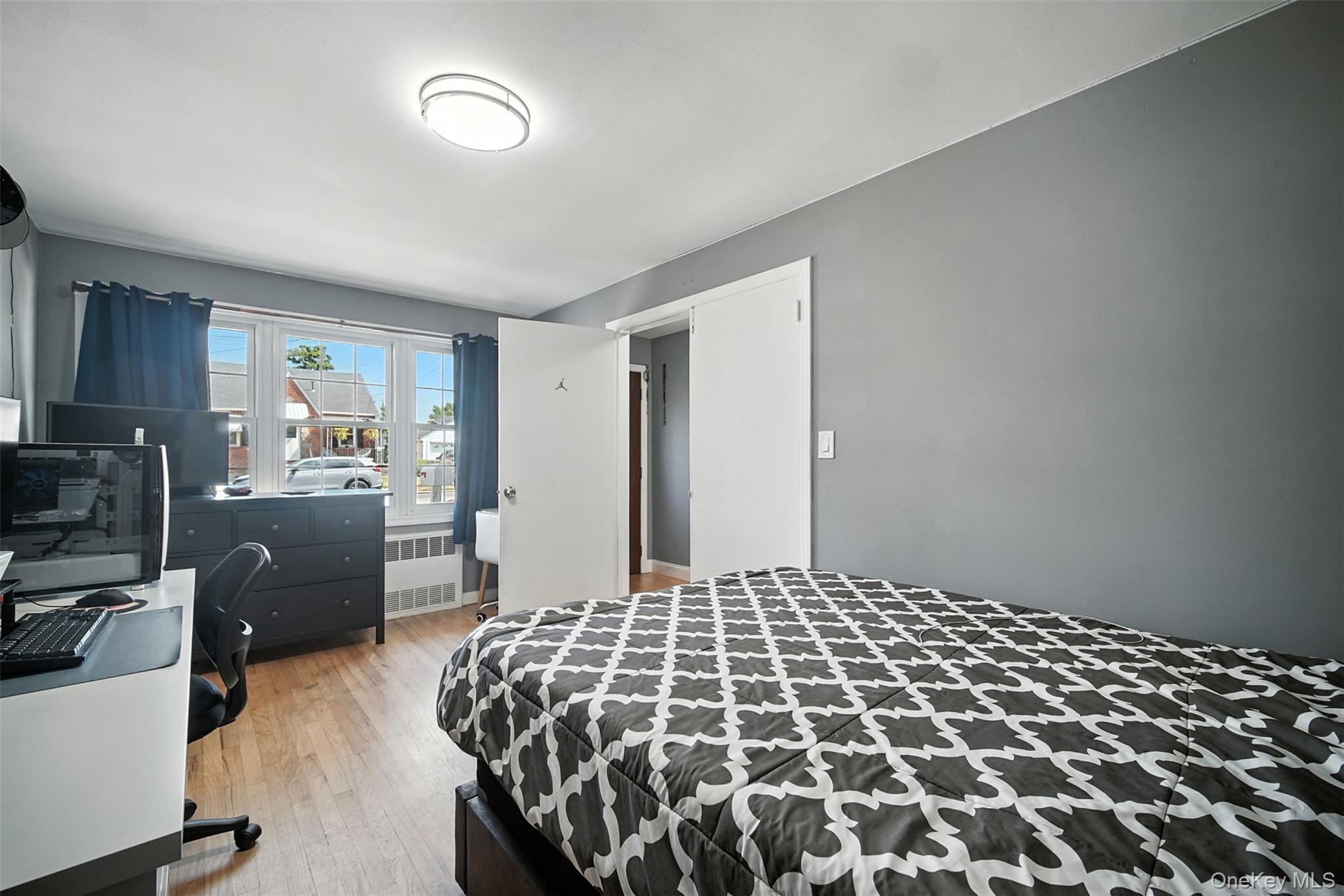 112 Casper Street Valley Stream, NY 11580 - Photo 11 of 26 a bedroom with a bed and a television