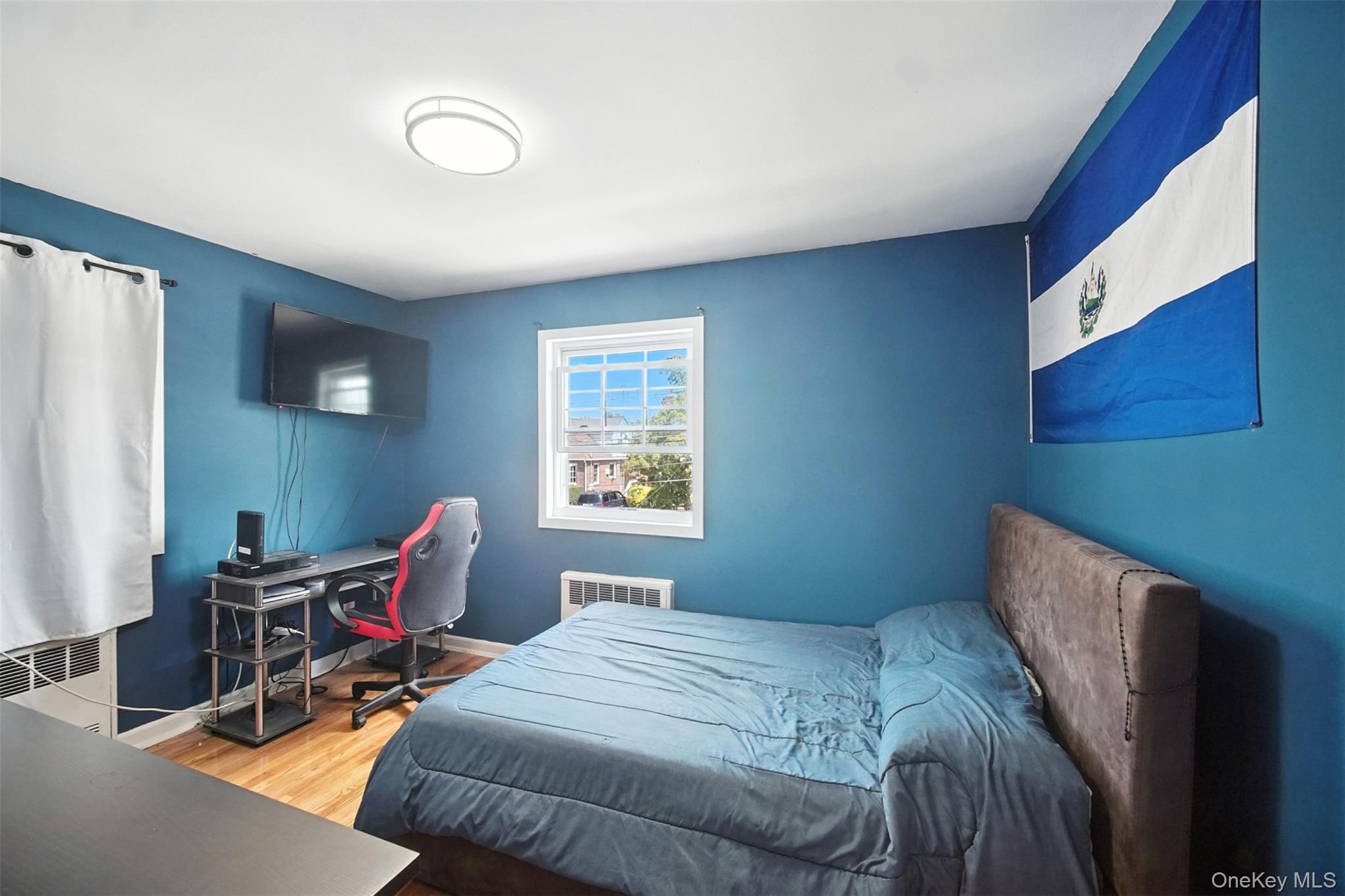 112 Casper Street Valley Stream, NY 11580 - Photo 15 of 26 a bedroom with bed and a window