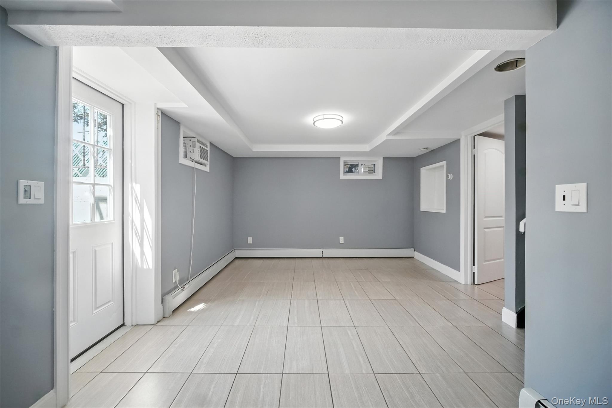 112 Casper Street Valley Stream, NY 11580 - Photo 20 of 26 a view of an empty room with wooden floor