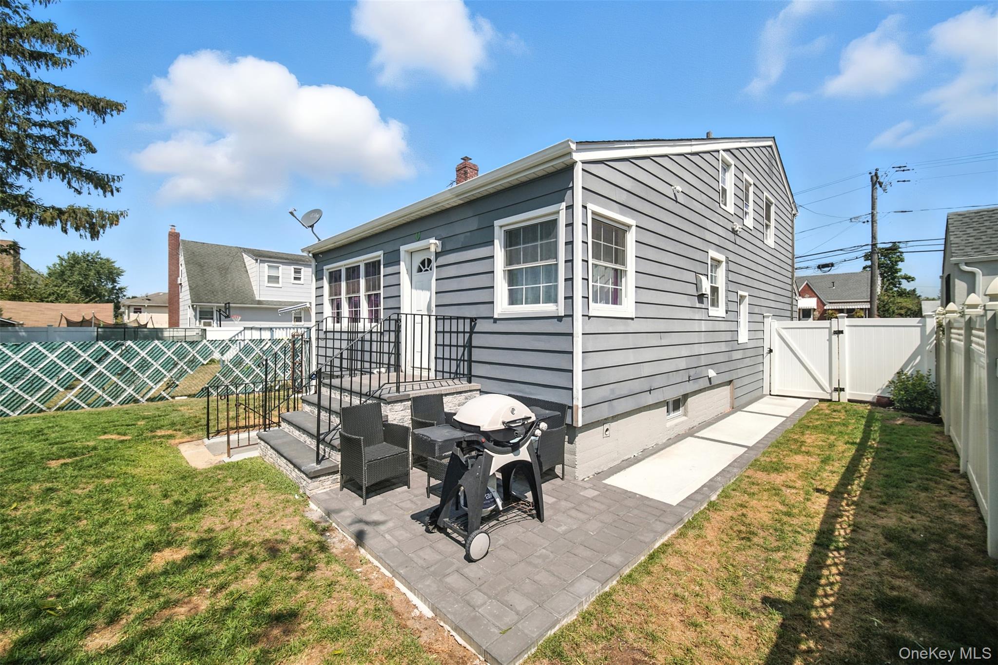 112 Casper Street Valley Stream, NY 11580 - Photo 25 of 26 a view of a patio with a table and chairs