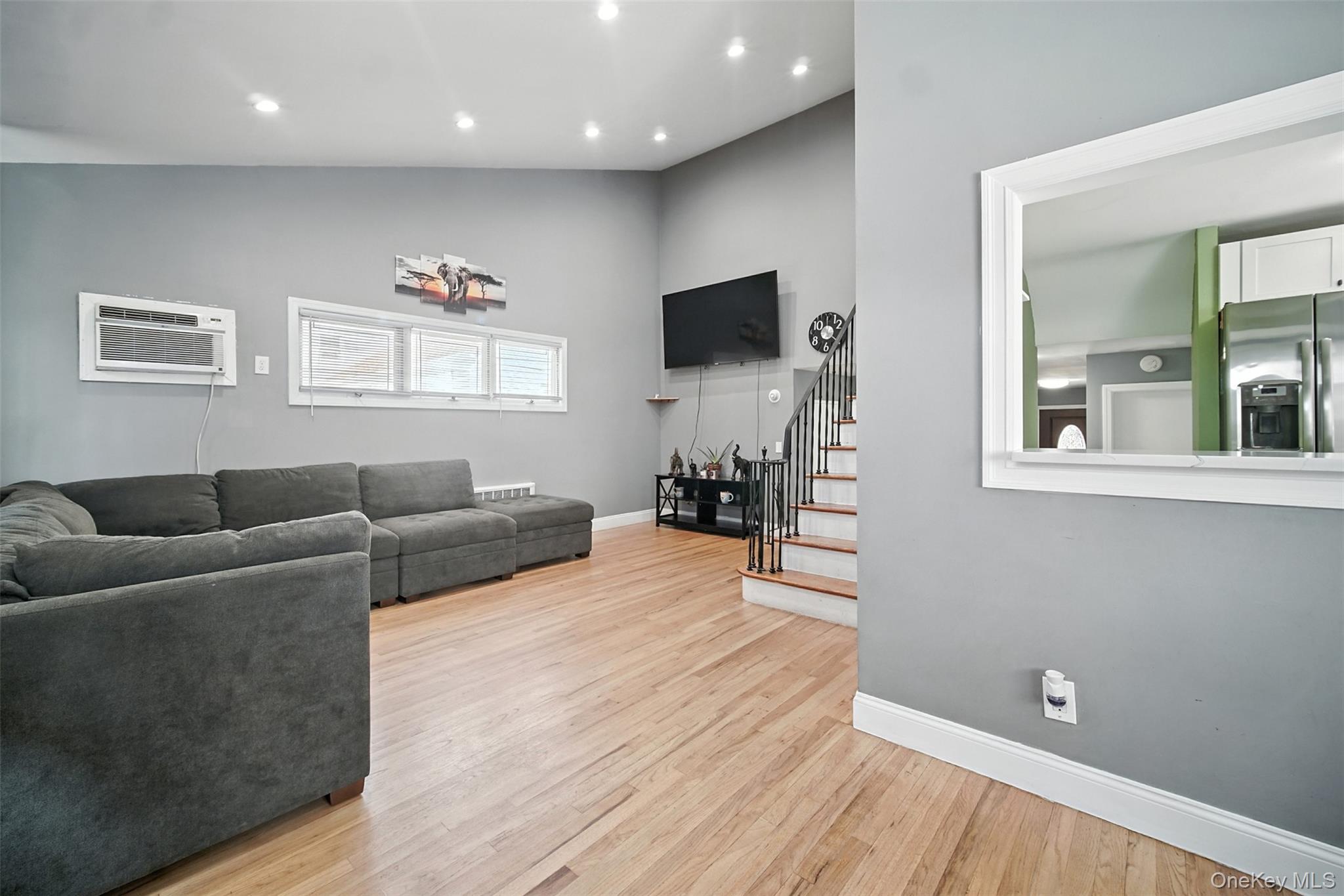 112 Casper Street Valley Stream, NY 11580 - Photo 6 of 26 a living room with furniture and a flat screen tv