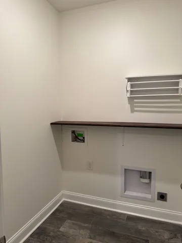 an empty room with a window and a ceiling fan