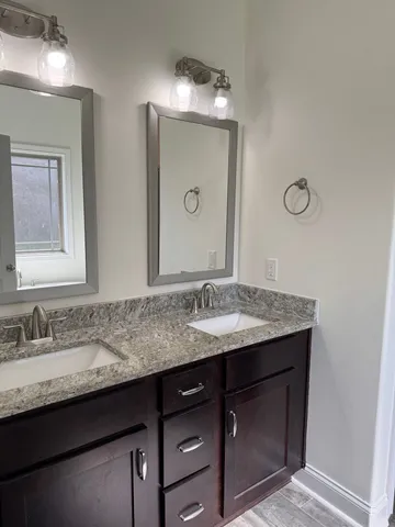 a bathroom with a glass shower door