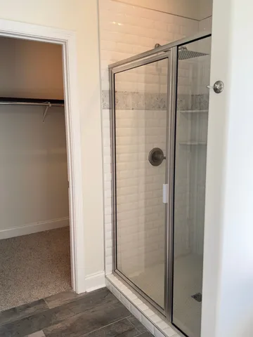 a bathroom with a bathtub and shower