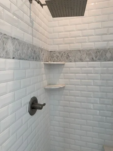 a bathroom with a granite countertop sink vanity and a mirror