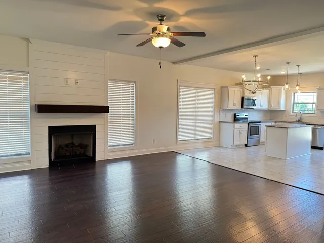 a view of a kitchen with a sink and a fireplace