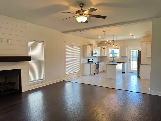 a kitchen with a refrigerator a sink and a oven
