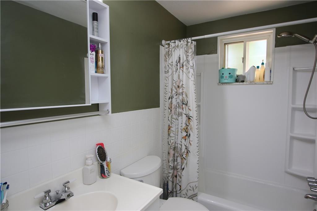 520 Oregon Street Monongahela, PA 15063 - Photo 13 of 31 a bathroom with a shower curtain and a sink