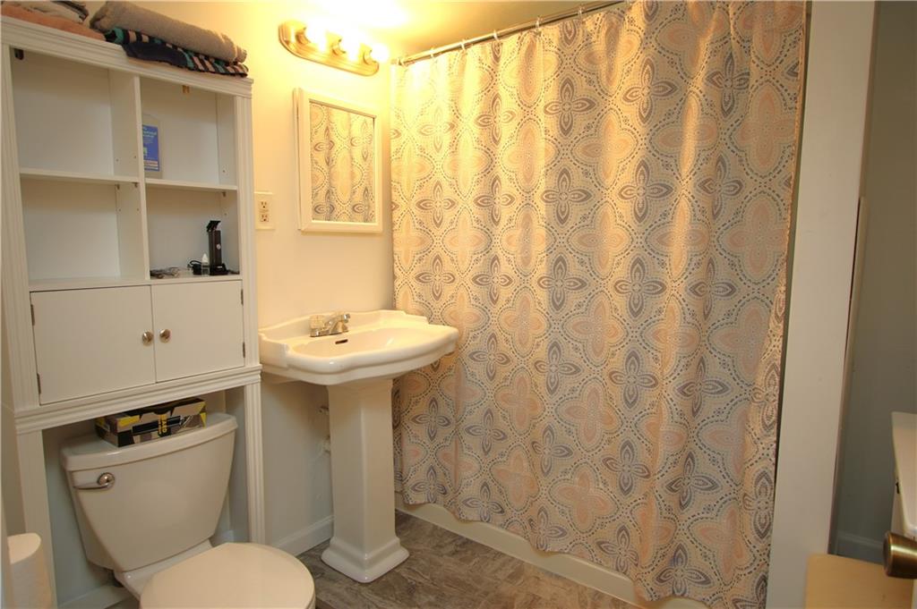 520 Oregon Street Monongahela, PA 15063 - Photo 16 of 31 a bathroom with a sink a toilet and shower curtain