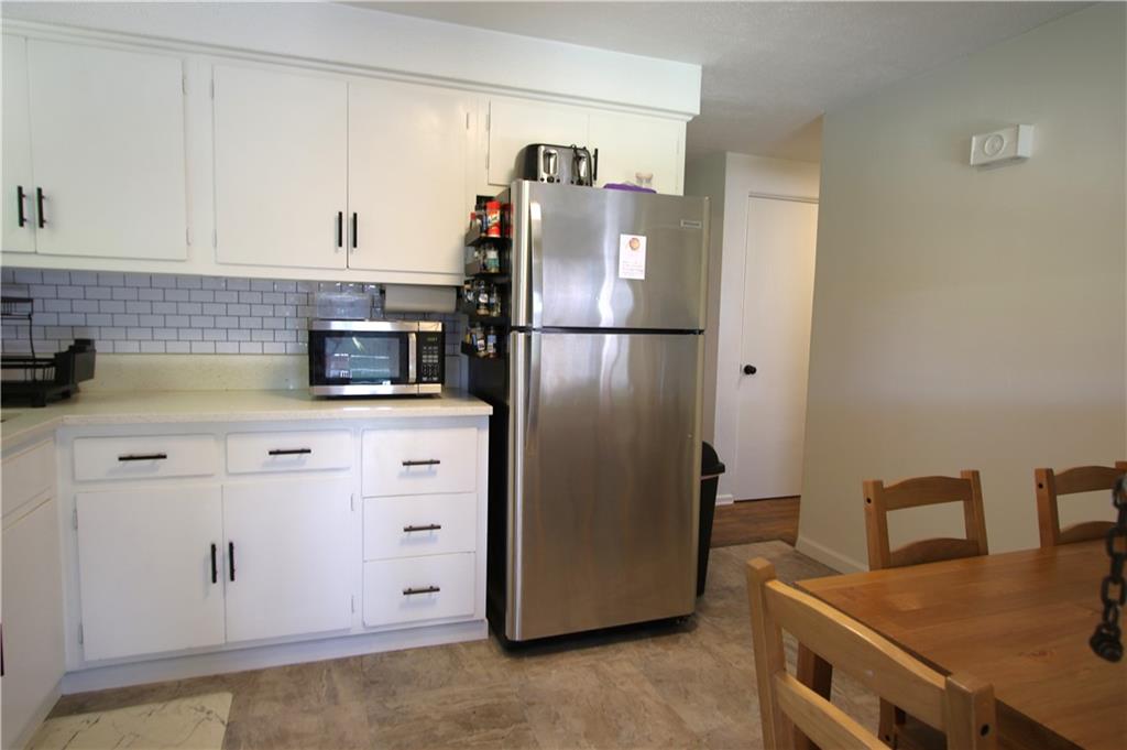 520 Oregon Street Monongahela, PA 15063 - Photo 2 of 31 a kitchen with stainless steel appliances white cabinets and a refrigerator