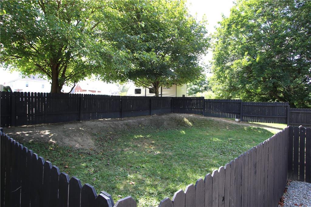 520 Oregon Street Monongahela, PA 15063 - Photo 21 of 31 a view of a backyard with wooden fence and a large tree