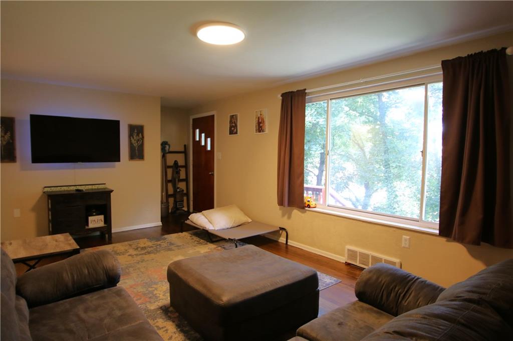 520 Oregon Street Monongahela, PA 15063 - Photo 6 of 31 a living room with furniture a fireplace and a flat screen tv