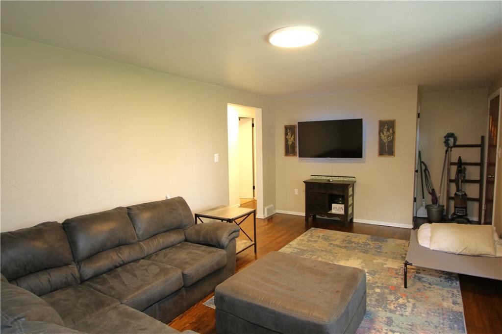 520 Oregon Street Monongahela, PA 15063 - Photo 9 of 31 a living room with furniture a fireplace and a flat screen tv